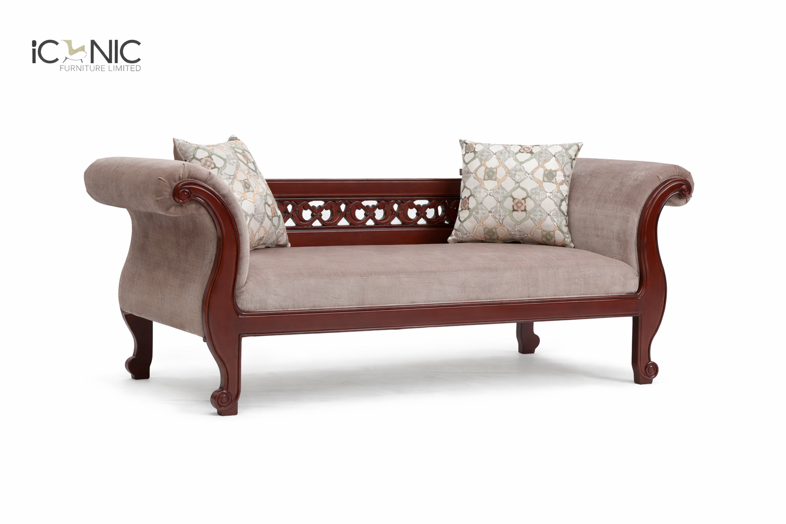 Iconic Furniture luxury Victorian style wooden divan with mauve fabric upholstery and intricate mahogany wood carvings for living room decor.
