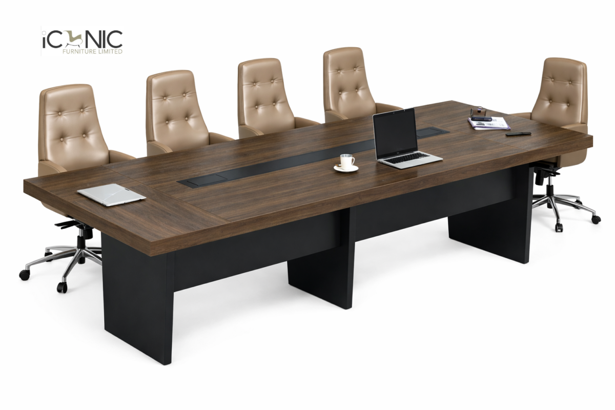 Large dark walnut executive conference table with integrated cable management and beige leather high-back chairs by Iconic Furniture Limited.