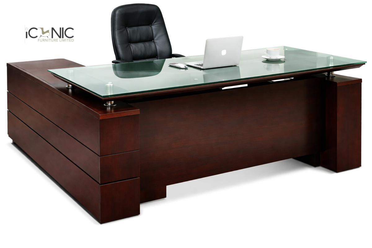 Premium L-shaped mahogany executive desk with a thick tempered glass floating top and integrated side return cabinet.