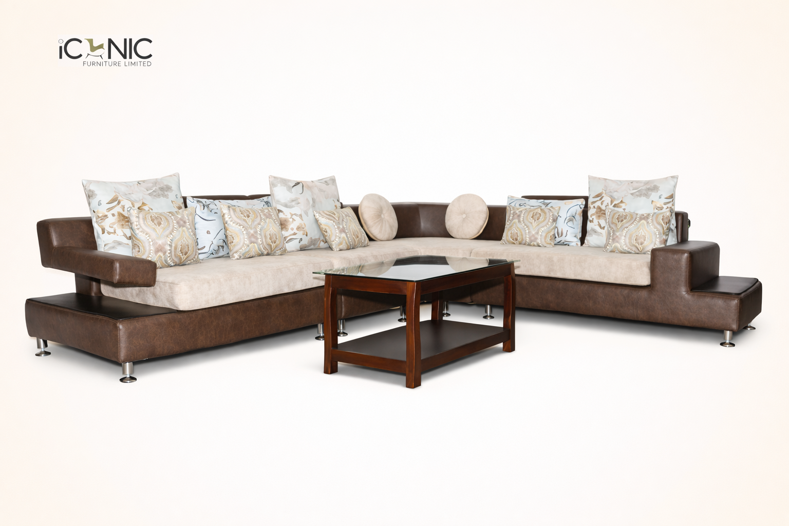 Iconic Furniture modern brown and cream L-shaped corner sofa with decorative patterned cushions and a wooden glass-top coffee table.