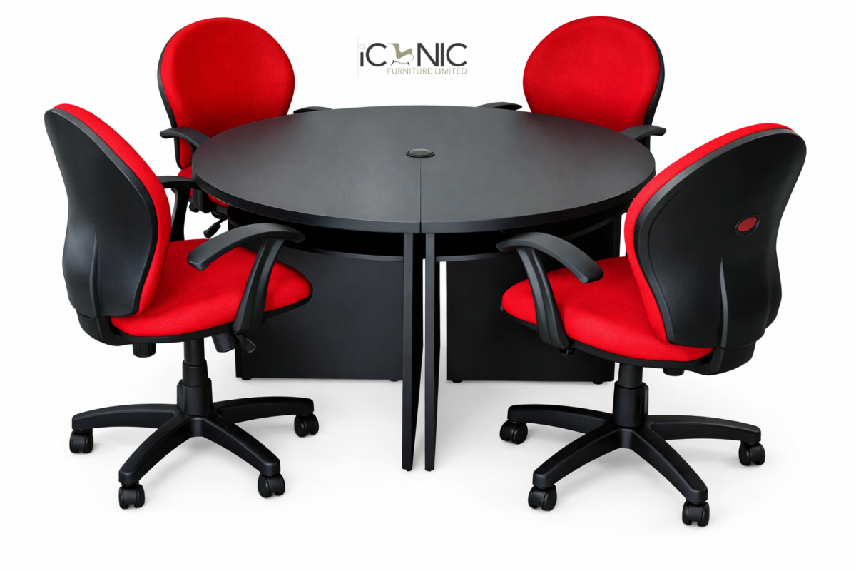 Compact black round meeting table with four red and black ergonomic office chairs by Iconic Furniture Limited.